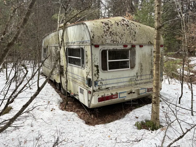 Old RV ready for professional camper removal and disposal