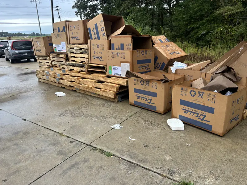 Cleaning Up Rural Dump Sites | Responsible Junk Removal for Abandoned Trash & Bulky Items Illegal dumping site in rural area with piles of trash, furniture, and debris near trees and mountains